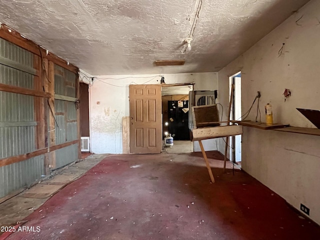 misc room with visible vents and a textured ceiling