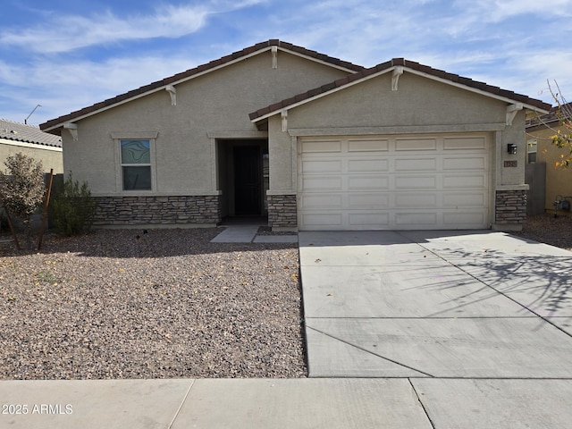 ranch-style home featuring a garage, stone siding, driveway, and stucco siding