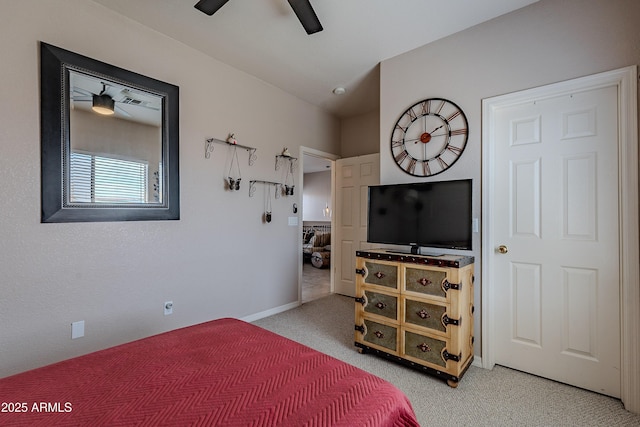 bedroom with baseboards, light colored carpet, and ceiling fan