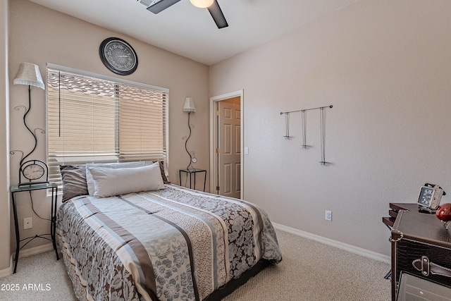 bedroom featuring a ceiling fan, baseboards, and light carpet