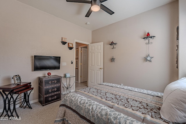 bedroom with light colored carpet, baseboards, and a ceiling fan