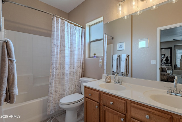 full bath with shower / tub combo, a sink, double vanity, and toilet