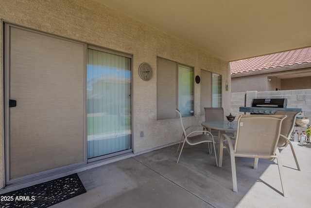 view of patio / terrace featuring outdoor dining space and fence