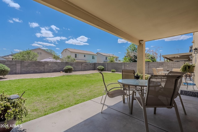 view of patio featuring a fenced backyard and outdoor dining space
