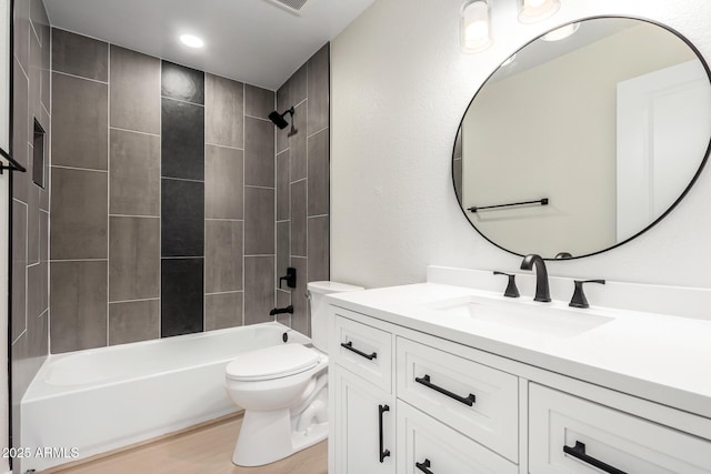 17040 N 39th Ave, Glendale, AZ 85308 - full bathroom featuring toilet, tub / shower combination, vanity, wood finished floors, and recessed lighting