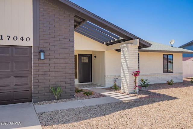 17040 N 39th Ave, Glendale, AZ 85308 - property entrance featuring brick siding and an attached garage