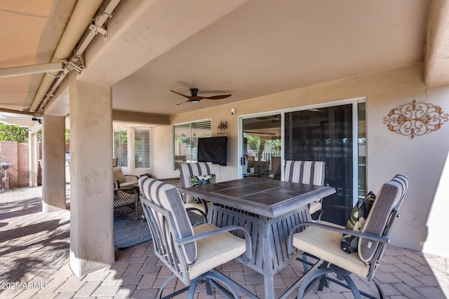 view of patio featuring ceiling fan and an outdoor living space