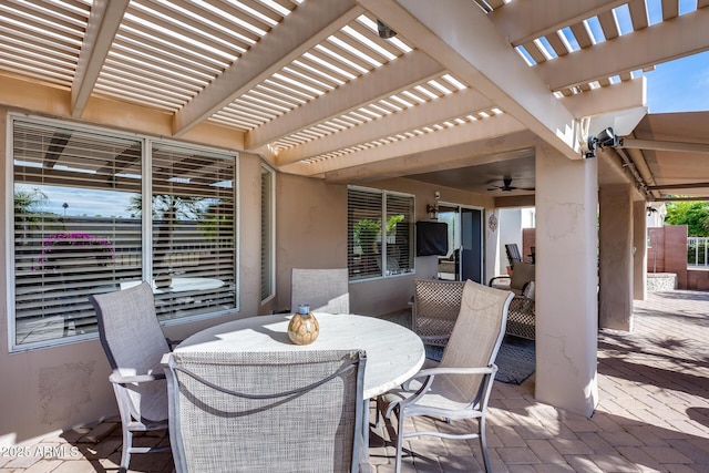 view of patio / terrace with a pergola, ceiling fan, and outdoor dining space