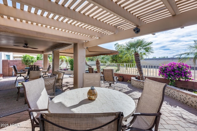 view of patio / terrace with a pergola, a ceiling fan, outdoor dining area, and fence