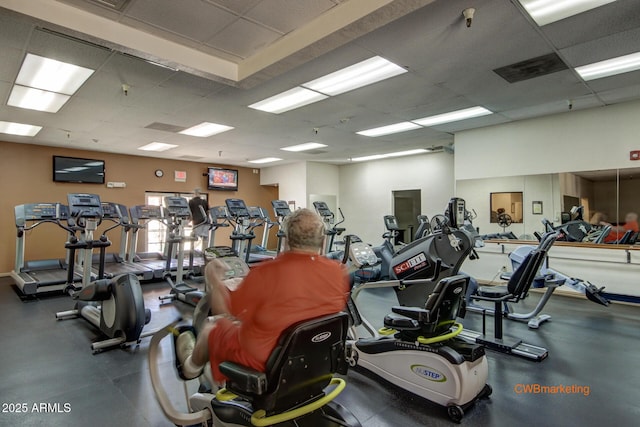 workout area featuring a paneled ceiling