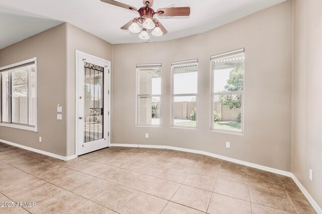 5541 W Desperado Way, Phoenix, AZ 85083 - empty room featuring light tile patterned floors, ceiling fan, and baseboards