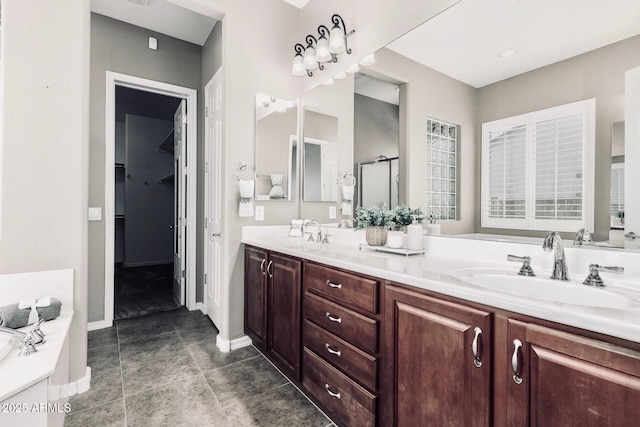 5541 W Desperado Way, Phoenix, AZ 85083 - full bathroom with double vanity, a bath, baseboards, and an enclosed shower