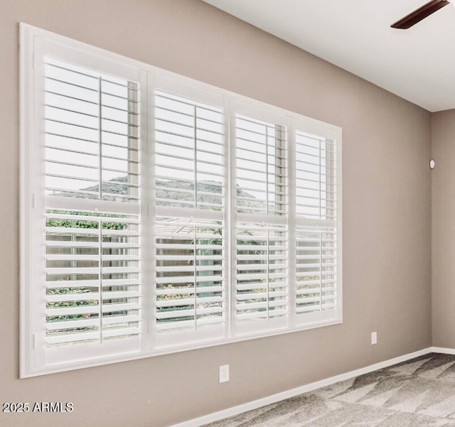 5541 W Desperado Way, Phoenix, AZ 85083 - detailed view of carpet flooring, baseboards, and ceiling fan