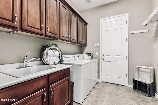 5541 W Desperado Way, Phoenix, AZ 85083 - washroom featuring cabinet space, washing machine and dryer, baseboards, and light tile patterned floors