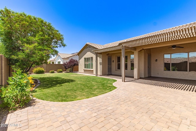 5541 W Desperado Way, Phoenix, AZ 85083 - back of house with ceiling fan, a patio area, stucco siding, and a tiled roof