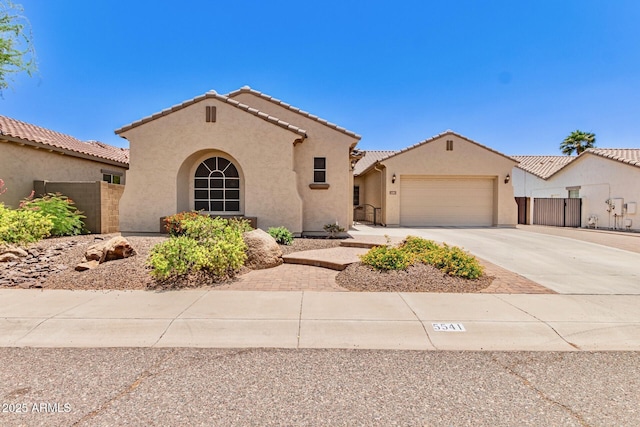 5541 W Desperado Way, Phoenix, AZ 85083 - mediterranean / spanish home with stucco siding, driveway, a garage, and a tile roof