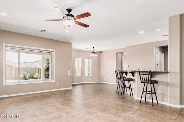 5541 W Desperado Way, Phoenix, AZ 85083 - living room with ceiling fan, light tile patterned floors, baseboards, recessed lighting, and a chandelier