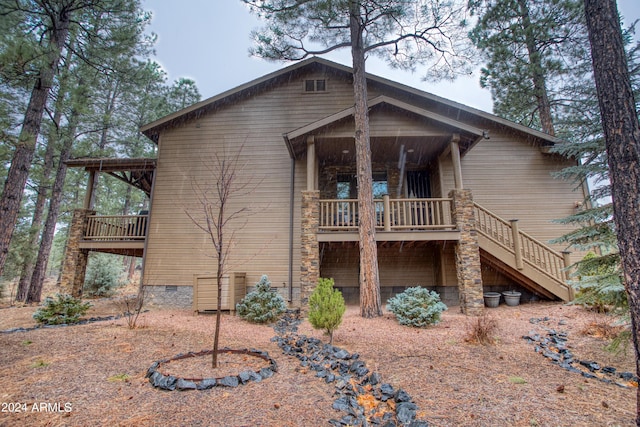 exterior space featuring crawl space and stairway