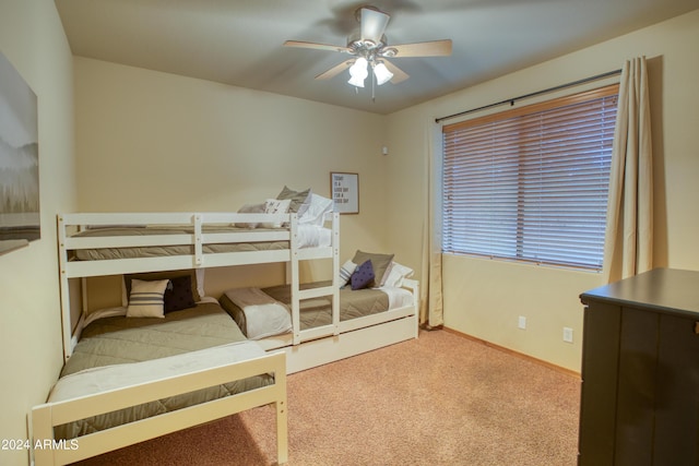 bedroom featuring ceiling fan, carpet flooring, and baseboards