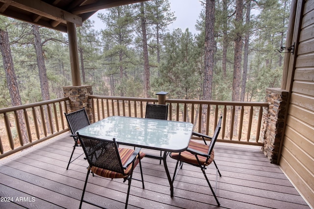 wooden deck with outdoor dining space