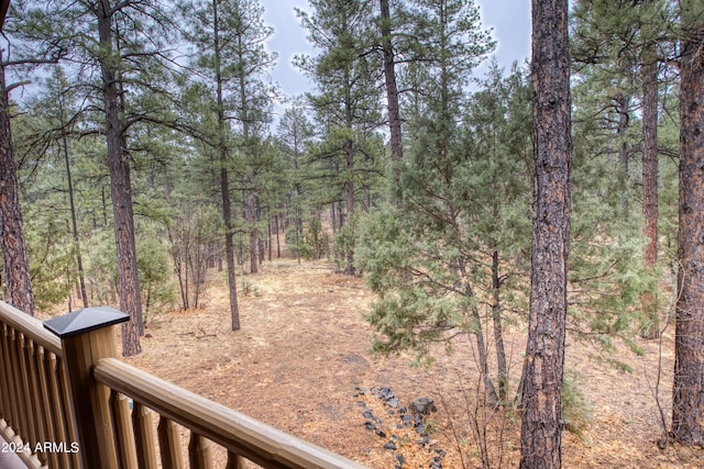 view of yard featuring a forest view