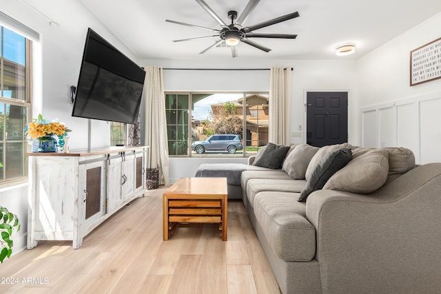 living room featuring light wood-style floors and ceiling fan