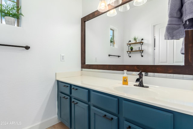 bathroom with baseboards and vanity