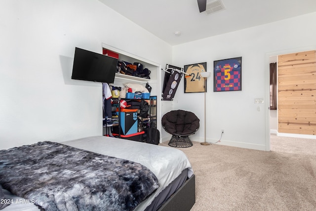 bedroom featuring carpet, visible vents, a closet, and baseboards