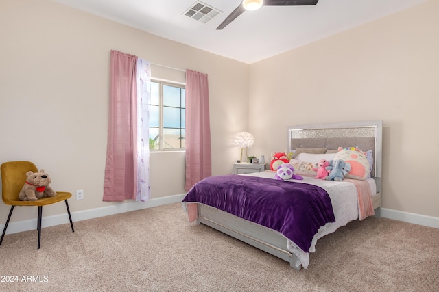 carpeted bedroom with a ceiling fan, baseboards, and visible vents