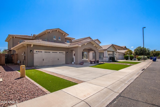 view of front of house with a garage and a front yard