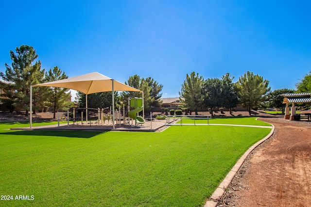 view of home's community featuring a yard and a playground