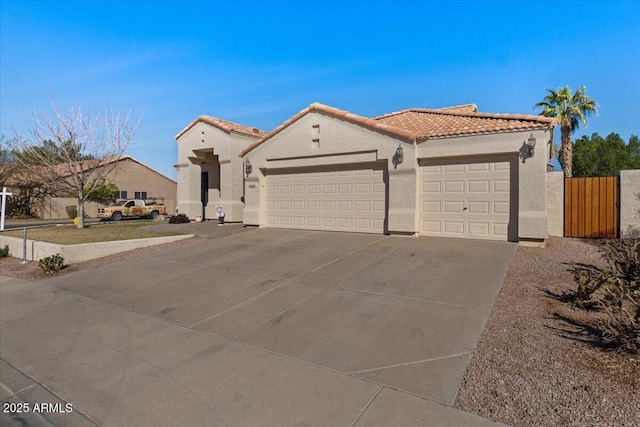 mediterranean / spanish-style house featuring a garage