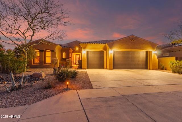 mediterranean / spanish-style home featuring a garage