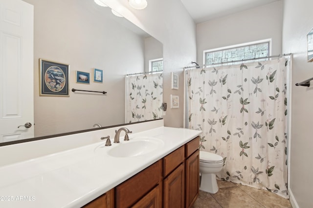 bathroom featuring toilet, walk in shower, tile patterned floors, and vanity