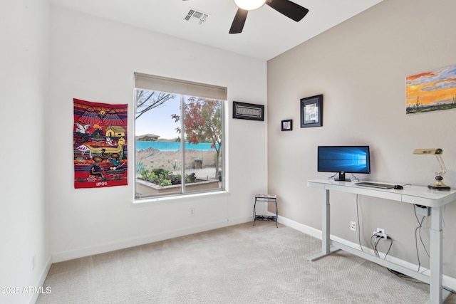 interior space with ceiling fan and carpet floors