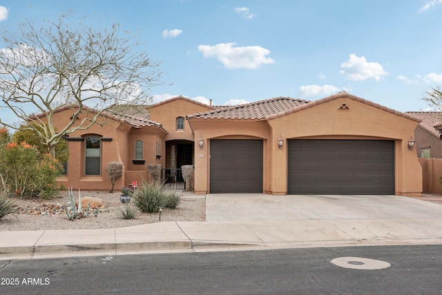 mediterranean / spanish-style house with a garage