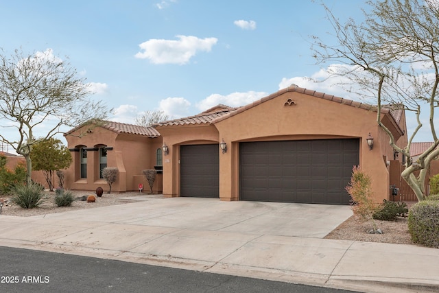 mediterranean / spanish-style home with a garage