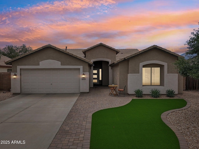 1070 S Amber St, Chandler, AZ 85286 - single story home featuring stucco siding, concrete driveway, a garage, and a tile roof