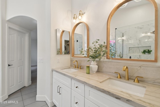 1070 S Amber St, Chandler, AZ 85286 - full bath with decorative backsplash, tile patterned floors, double vanity, and a marble finish shower