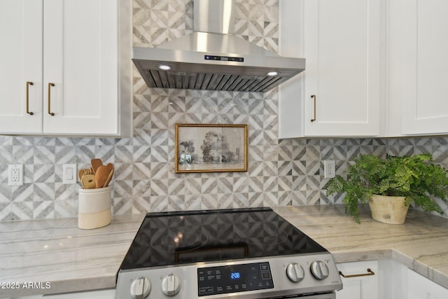1070 S Amber St, Chandler, AZ 85286 - kitchen featuring wall chimney exhaust hood, electric range, white cabinets, and backsplash