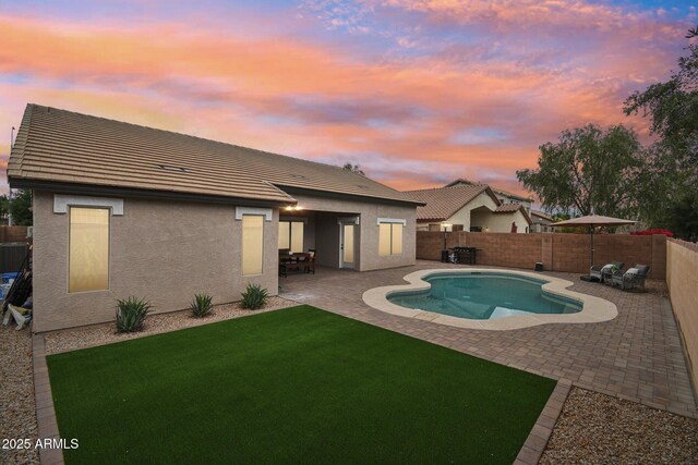 1070 S Amber St, Chandler, AZ 85286 - pool at dusk featuring a patio area