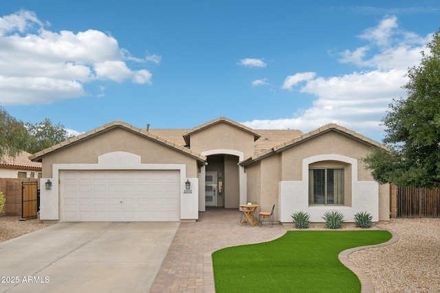 1070 S Amber St, Chandler, AZ 85286 - ranch-style house with concrete driveway, stucco siding, a garage, fence, and a tile roof