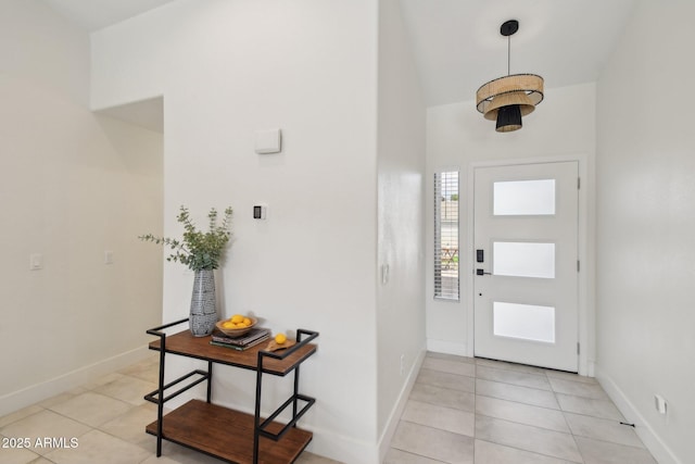 1070 S Amber St, Chandler, AZ 85286 - foyer entrance featuring light tile patterned floors, baseboards, and vaulted ceiling
