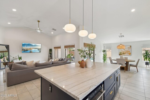 1070 S Amber St, Chandler, AZ 85286 - kitchen with light tile patterned flooring, open floor plan, recessed lighting, a kitchen island, and pendant lighting