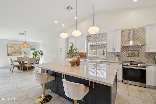 1070 S Amber St, Chandler, AZ 85286 - kitchen featuring stainless steel electric range oven, wall chimney range hood, a sink, lofted ceiling, and tasteful backsplash