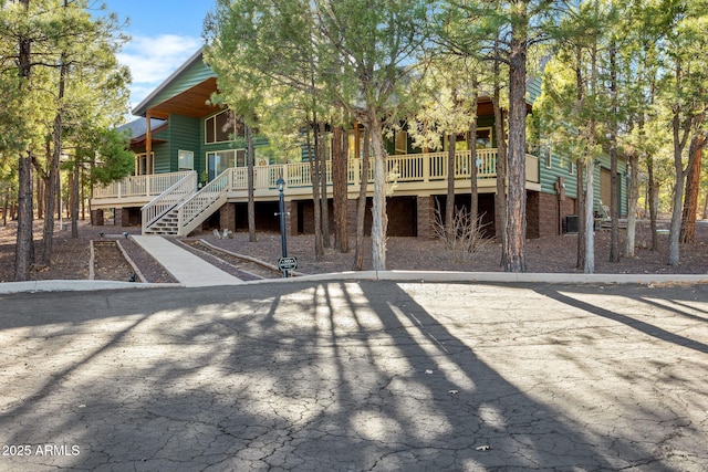 back of house featuring a wooden deck