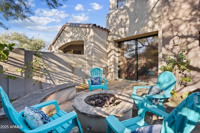 view of patio with a fire pit