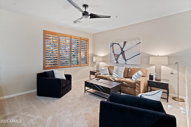 living room featuring light colored carpet and ceiling fan