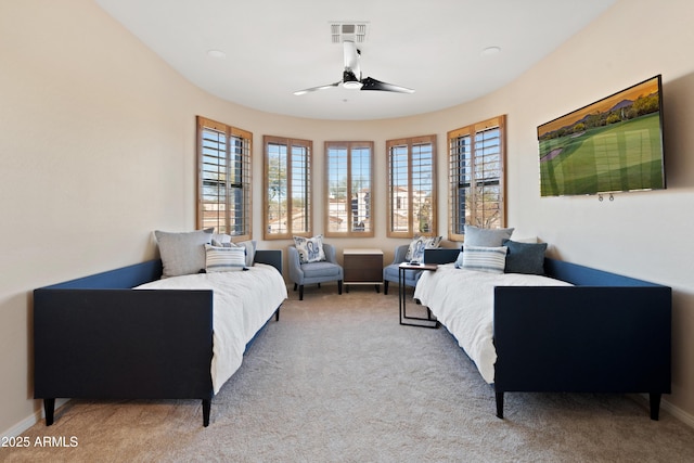 bedroom featuring ceiling fan and light colored carpet