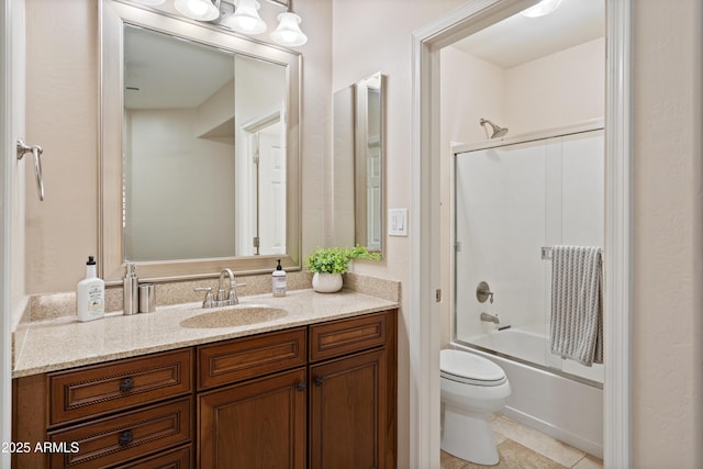 full bathroom featuring toilet, vanity, tile patterned floors, and combined bath / shower with glass door